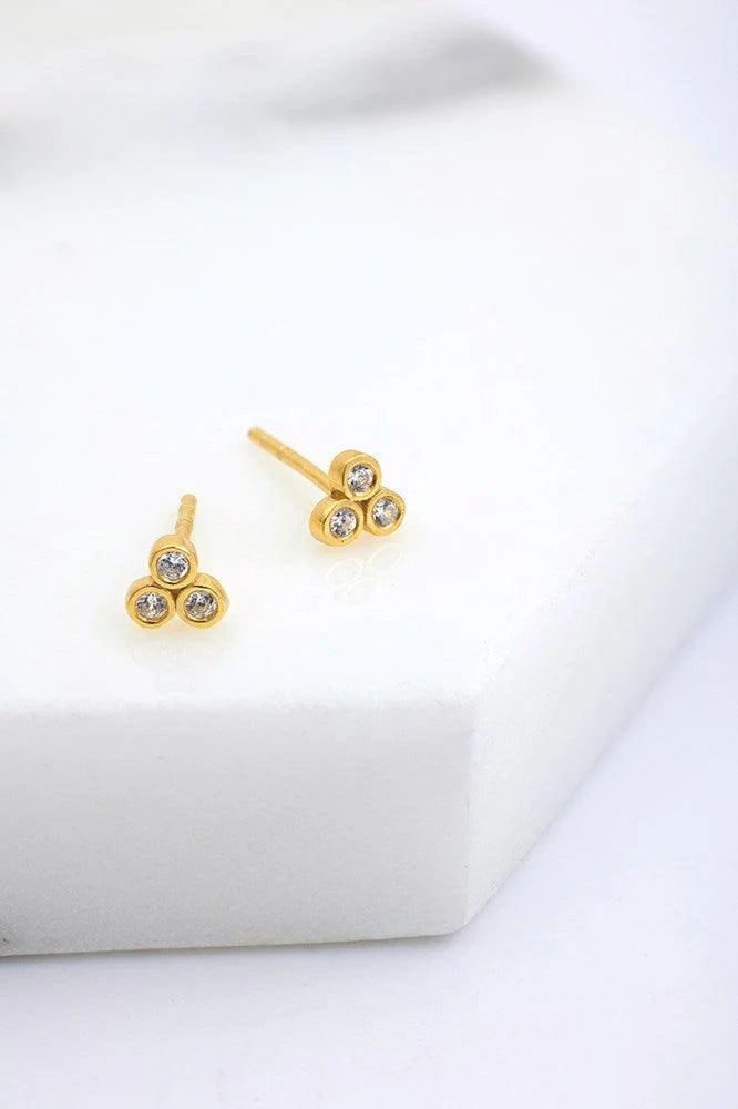 Gold stud earrings with 3 round crystals on each stud. 