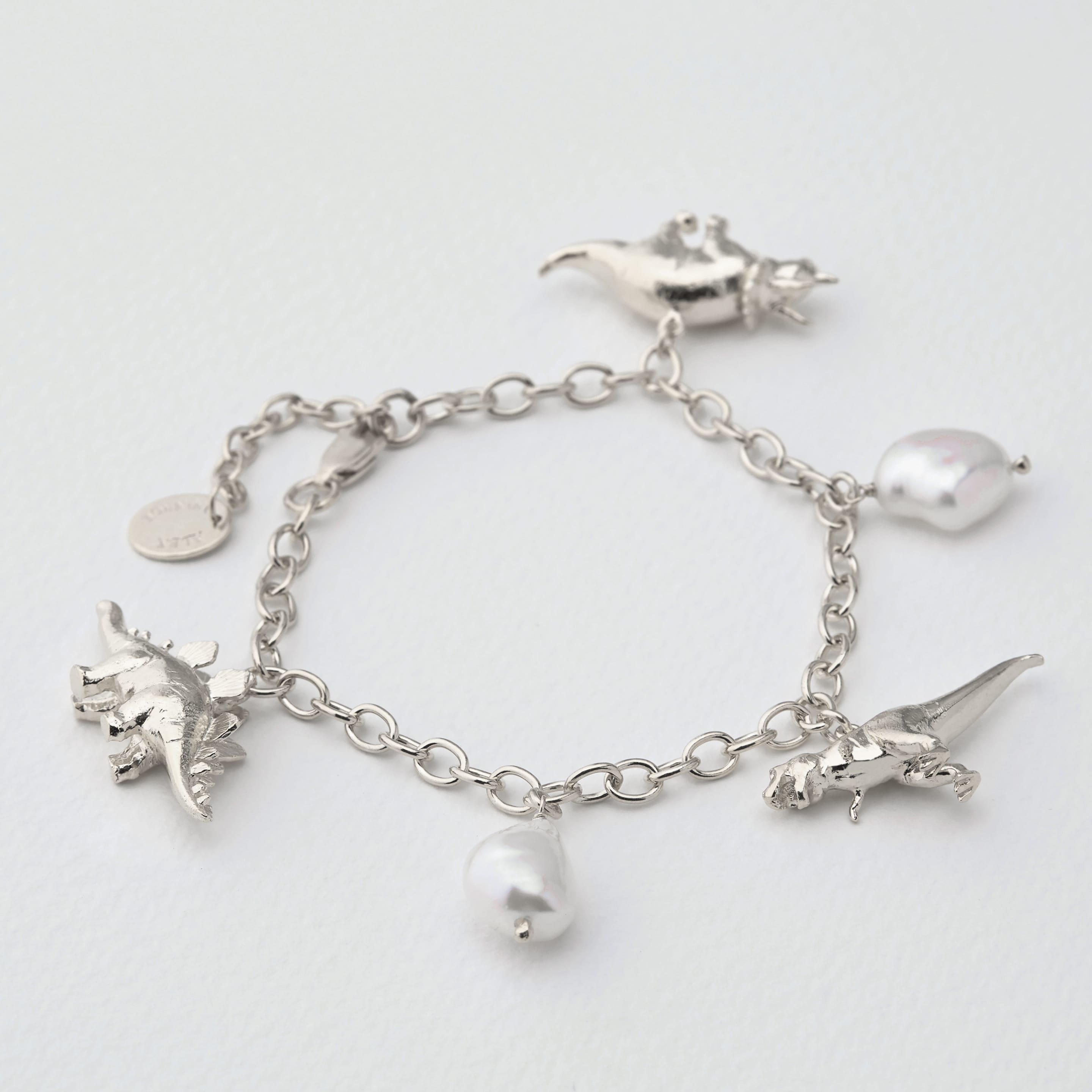 Dinosaur and baroque pearl bracelet by Alex Monroe